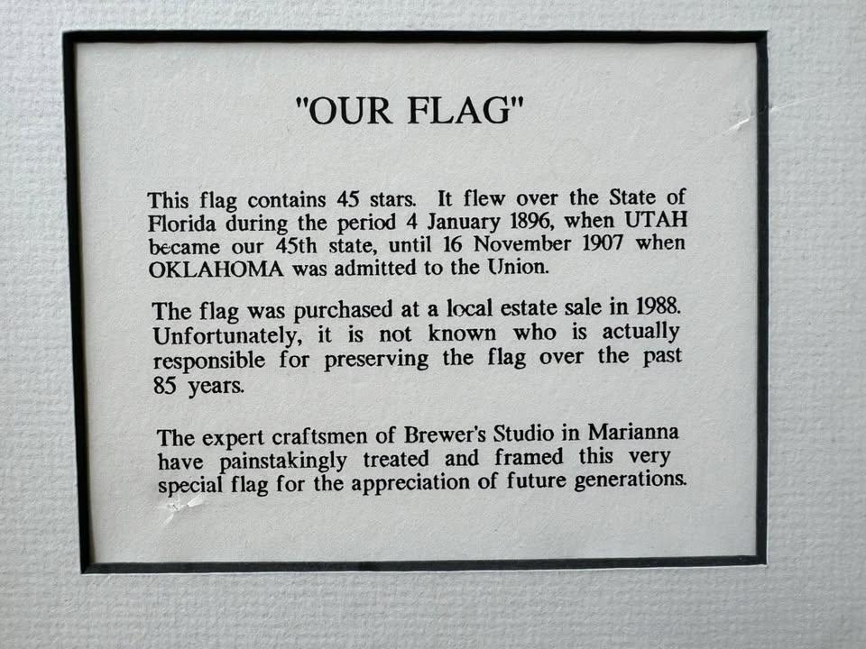 Plaque detailing some history of this American flag